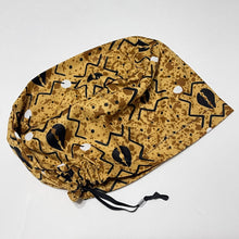 Load image into Gallery viewer, Niceroy Surgical SCRUB CAP black cowries on Tan tribal fabric Europe style nursing caps African print fabric and satin lining option.