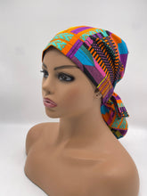 Load image into Gallery viewer, Ponytail Ankara PONY SCRUB CAP, Kente cotton fabric surgical scrub hat pony nursing caps and satin lining option for locs /Long Hair