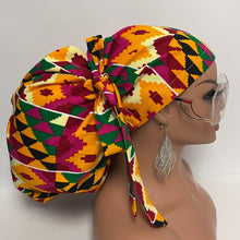 Load image into Gallery viewer, 2XL JUMBO PONY SCRUB Cap, Multicolored Kente Tribal cotton fabric surgical nursing hat for Extra long/thick Hair/Locs