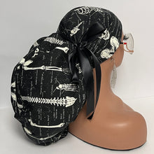 Load image into Gallery viewer, 2XL JUMBO PONY SCRUB Cap, Black white glow in the dark skeleton cotton fabric surgical hat satin for Extra long/thick Hair/Locs