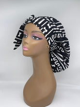 Load image into Gallery viewer, Adjustable Ankara PONY SCRUB CAP, black and white cotton fabric surgical scrub hat nursing caps and satin lining option for locs /Long Hair