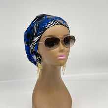 Load image into Gallery viewer, Niceroy surgical SCRUB HAT CAP,  Ankara Europe style nursing cap royal blue, white and black African print fabric and satin lining option.